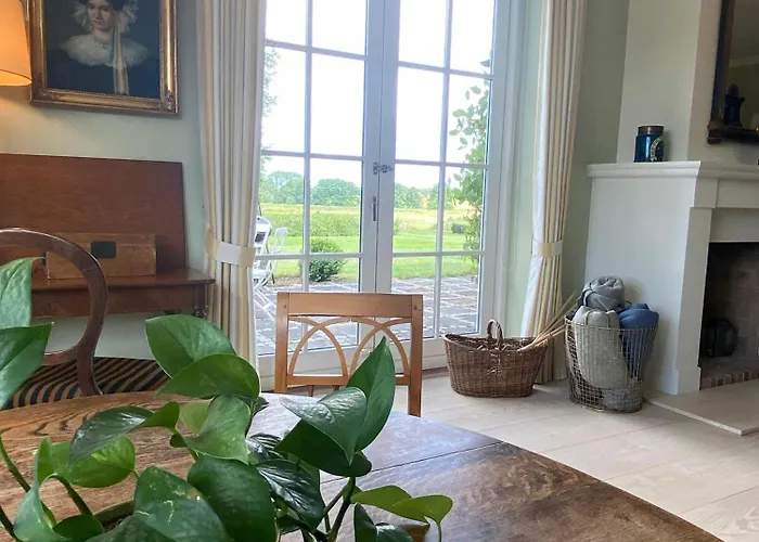 Manor House Overlooking Fields And Garden